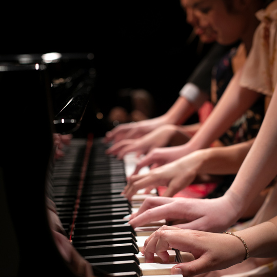 students playing piano