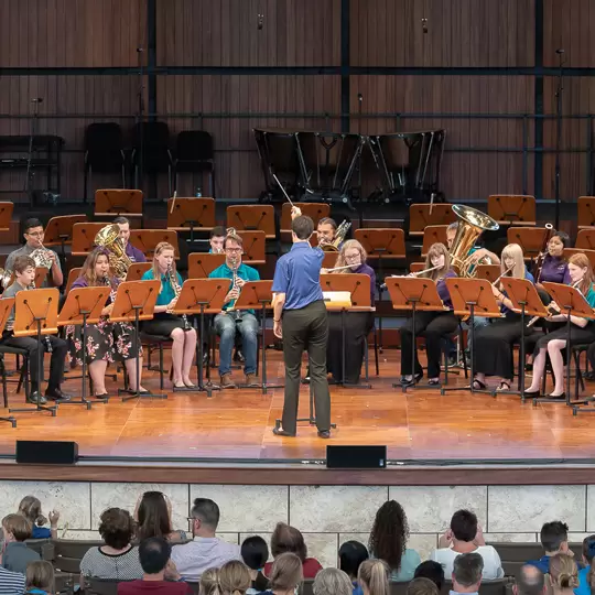 students performing woodwind brass instruments