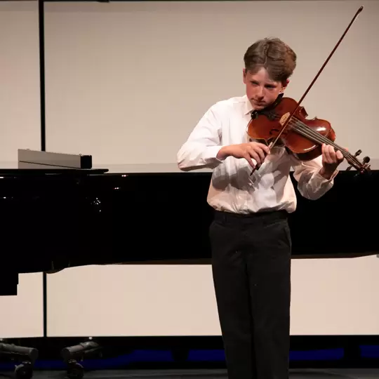 Student playing violin